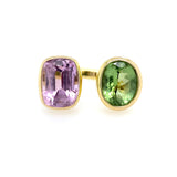 A 14K yellow gold ring with one large pink Kunzite gemstone on the left and one large green Tourmaline gemstone on the right, set in a polished gold band.