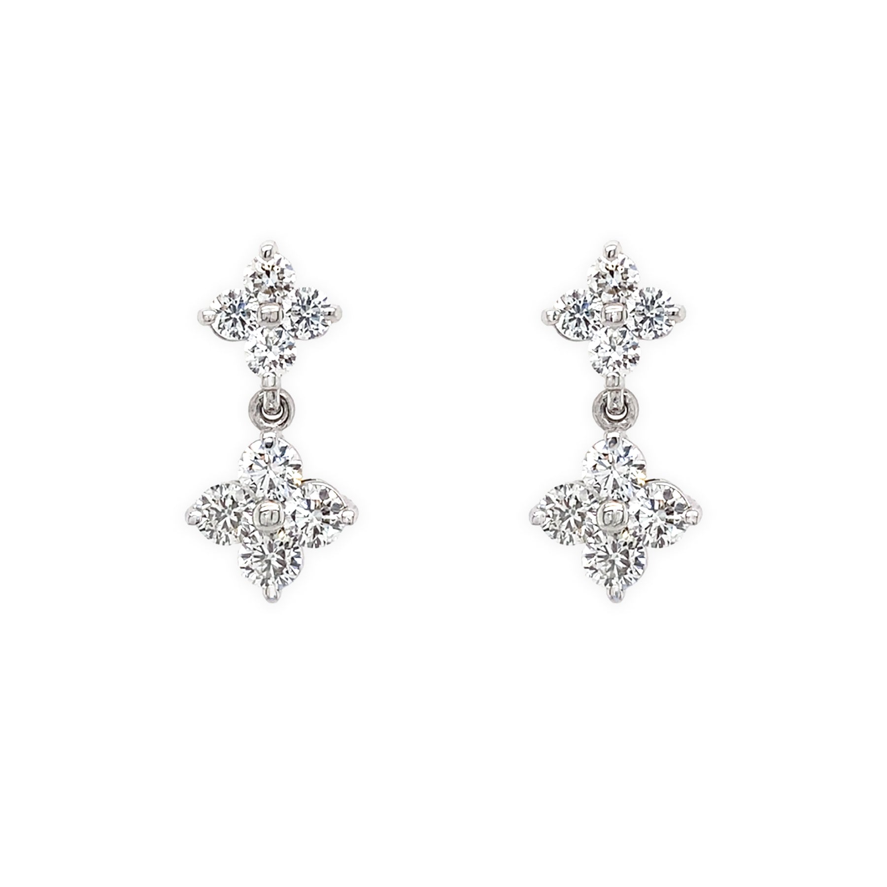 Pair of 14K white gold earrings with clover-shaped diamond designs on a white background