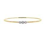 14K Gold bracelet with three bezel diamonds on a white background