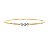 14K Gold bracelet with three bezel diamonds on a white background
