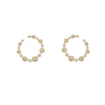 Gold hoop earrings with diamond accents on a white background