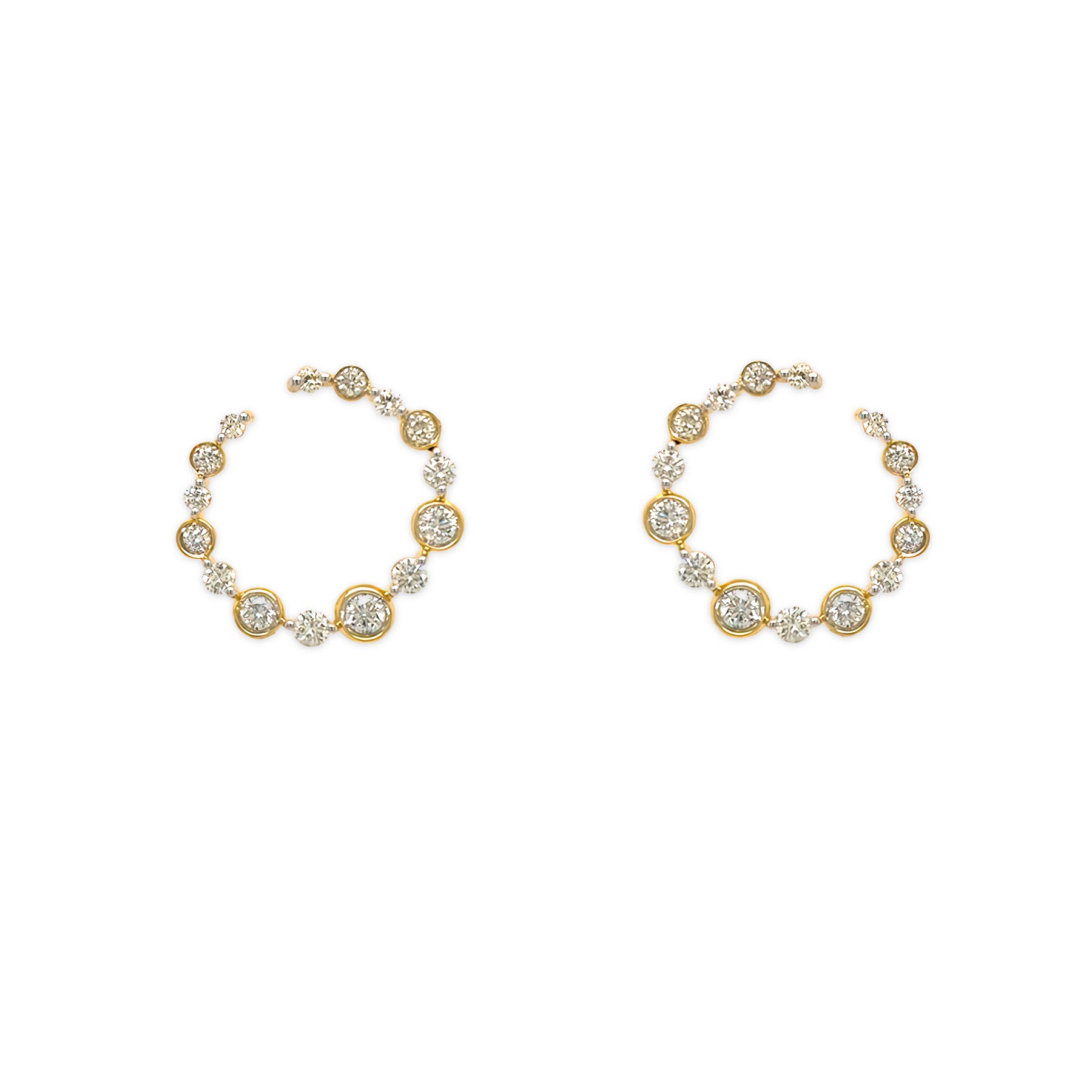 Gold hoop earrings with diamond accents on a white background
