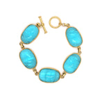 Gold bracelet with blue Venetian Glass stones on a white background