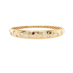 14K Gold bracelet with scattered diamond stones on a white background