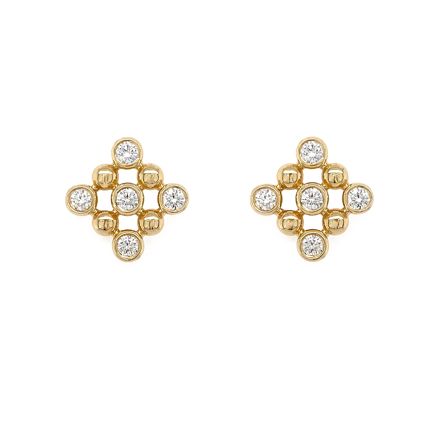 14K gold earrings with bezel diamond stones on a white background