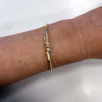 14K Yellow Gold Diamond Knot bracelet on model