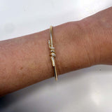 14K Yellow Gold Diamond Knot bracelet on model