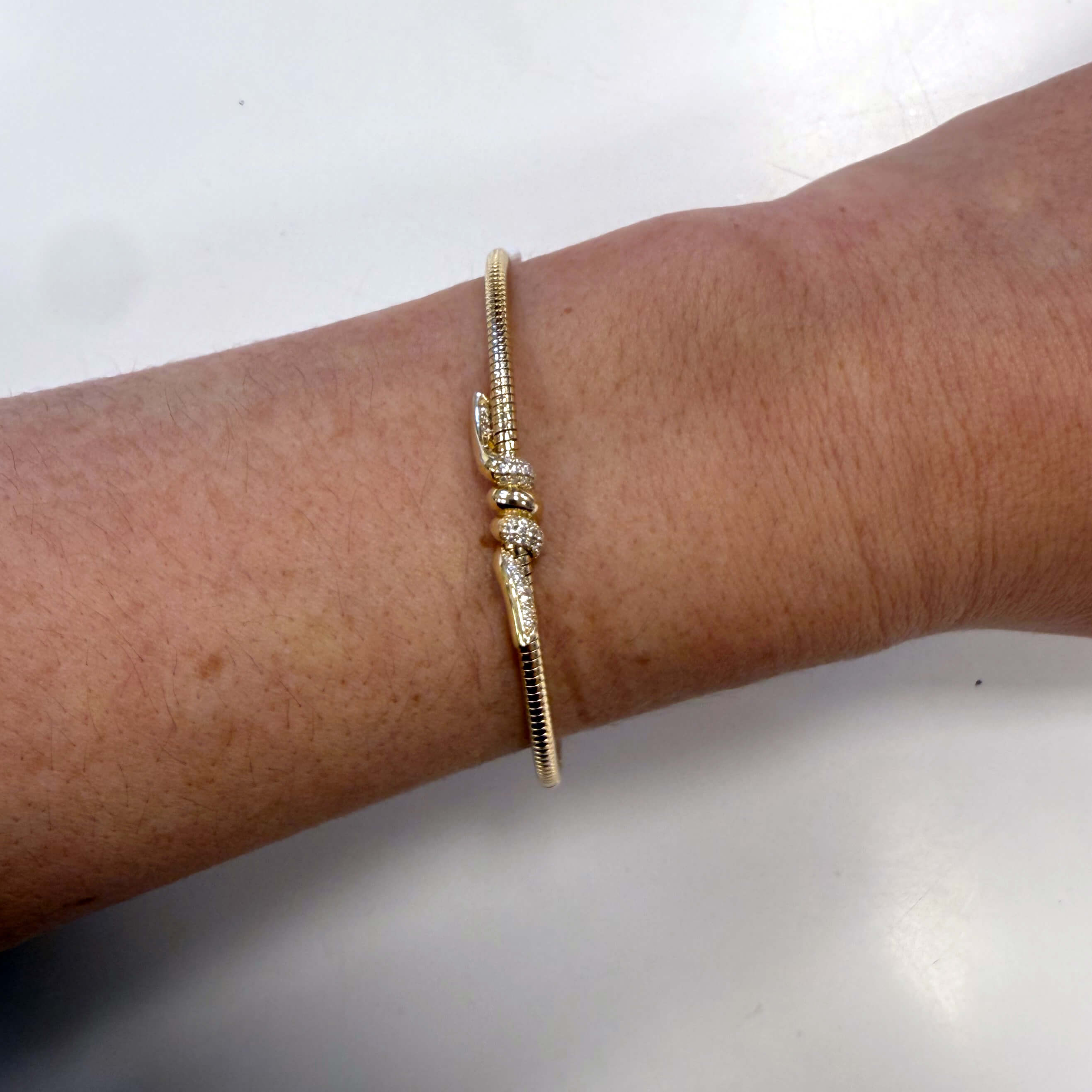 14K Yellow Gold Diamond Knot bracelet on model
