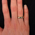 Woman wearing 14K Gold diamond and sapphire ring