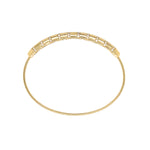 side view of 14k Gold stretch bracelet with a white background