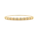 14K Gold bangle with embedded diamonds on a white background