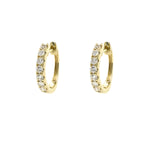 Gold hoop earrings with diamonds on a white background