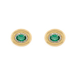 Pair of 14K gold earrings with emerald stones on a white background