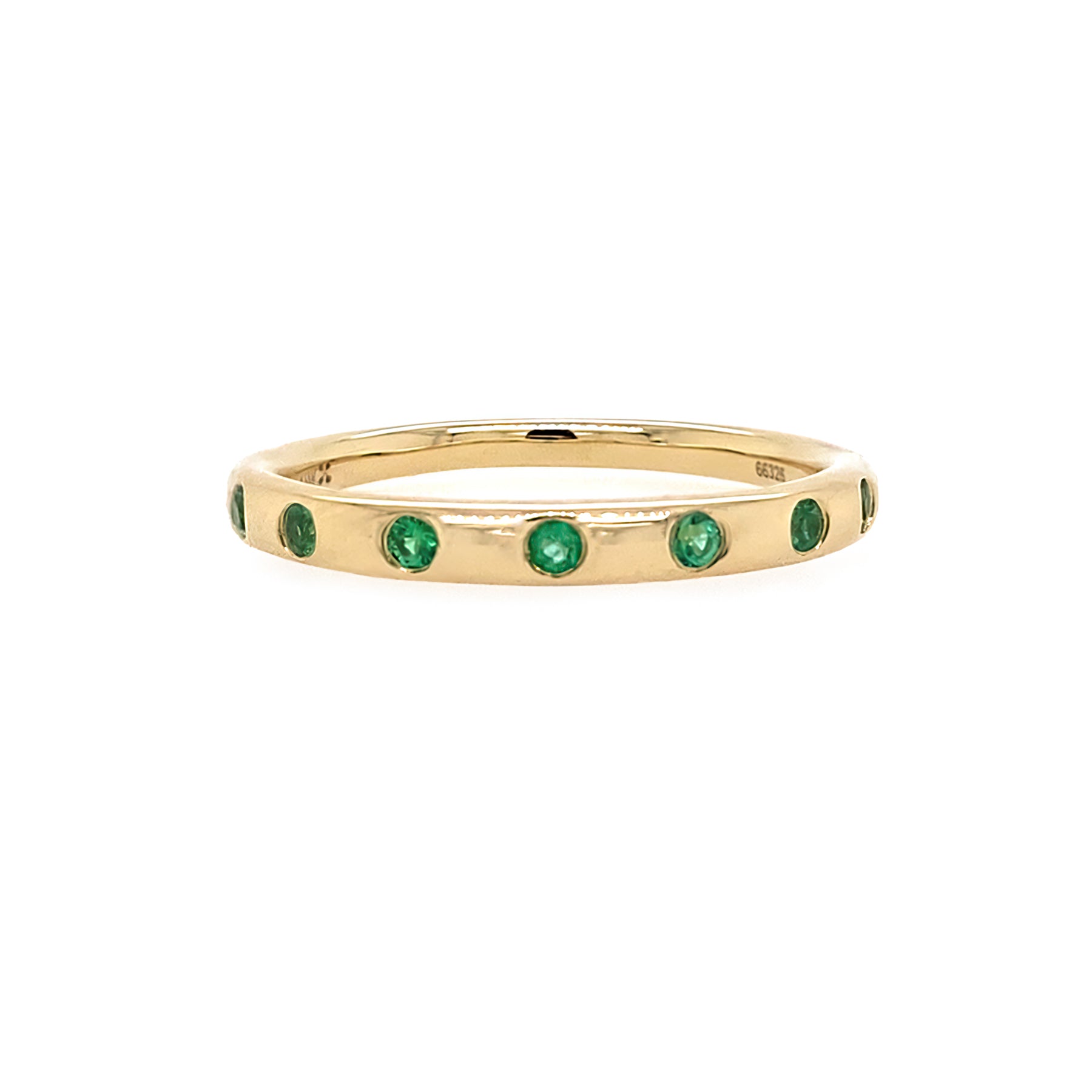 14K Gold ring with emerald stones on a white background