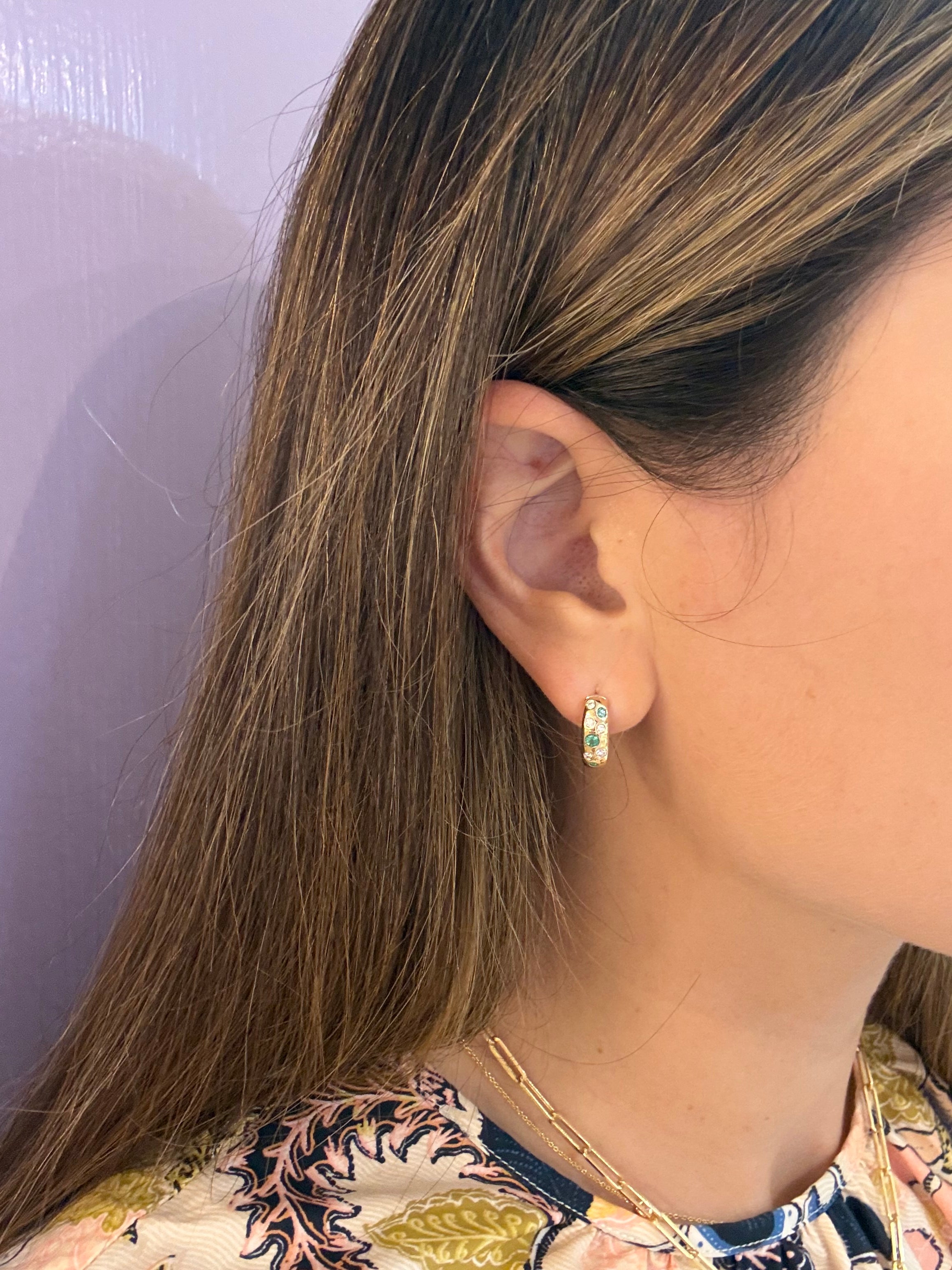 14k-Yellow-Gold-Emerald-and-Diamond-Scatter-Huggies on ear