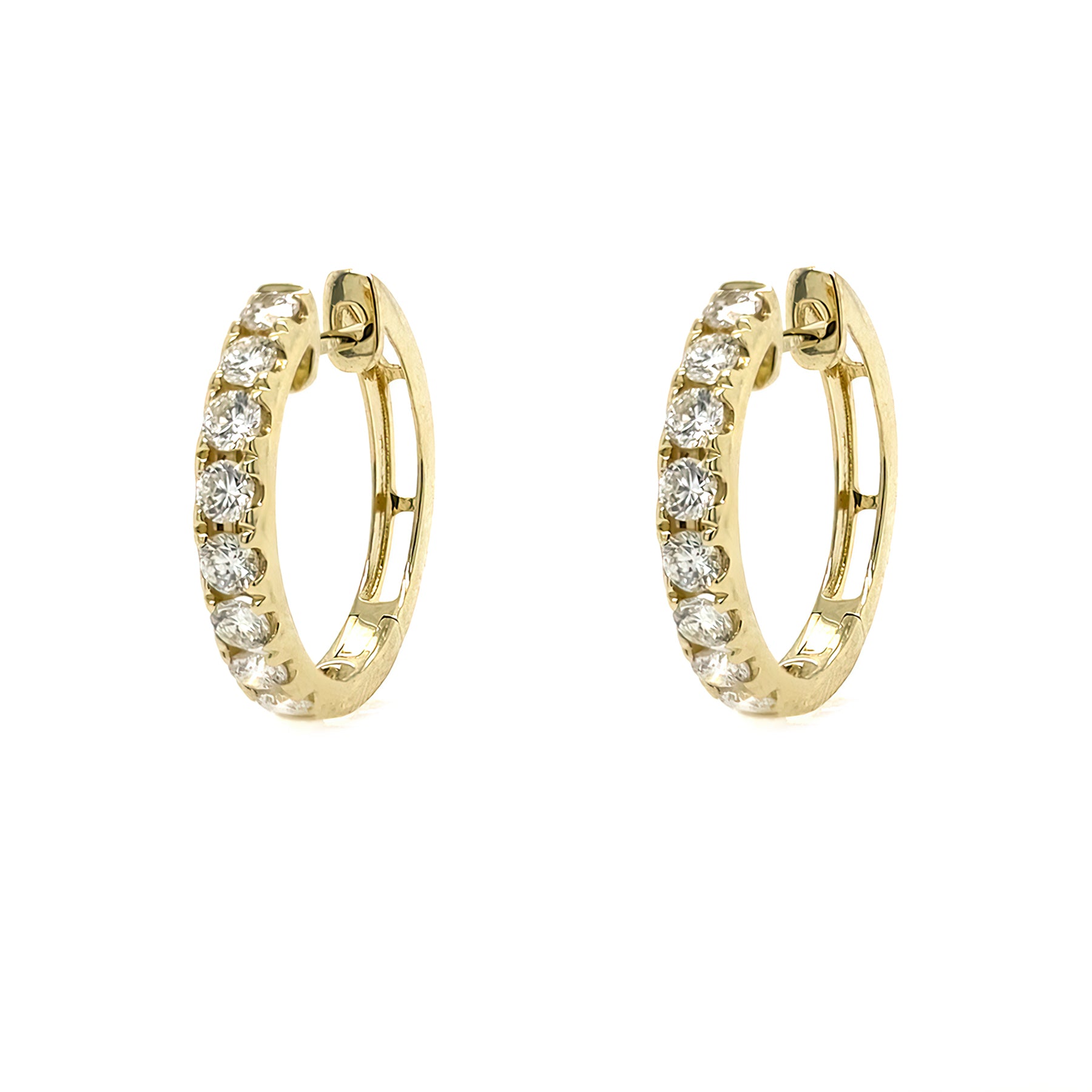 Gold hoop earrings with diamonds on a white background