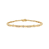 A 14K yellow gold bracelet with mixed shape diamonds.