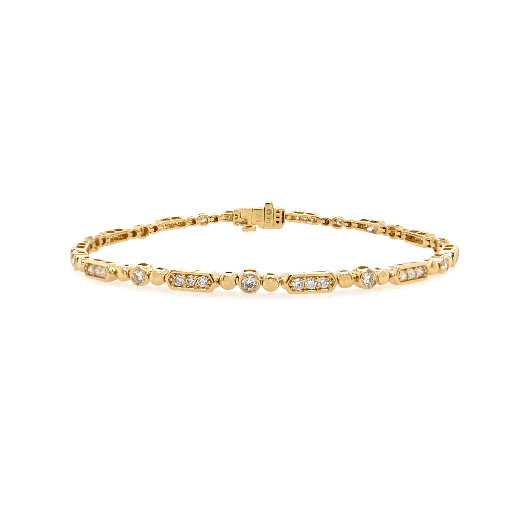 A 14K yellow gold bracelet with mixed shape diamonds.