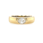 14K Gold ring with an oval diamond on a white background