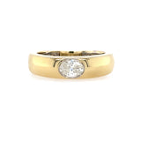 14K Gold ring with an oval diamond on a white background