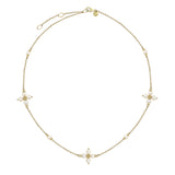 14K Gold necklace with pearl pendants on a white background