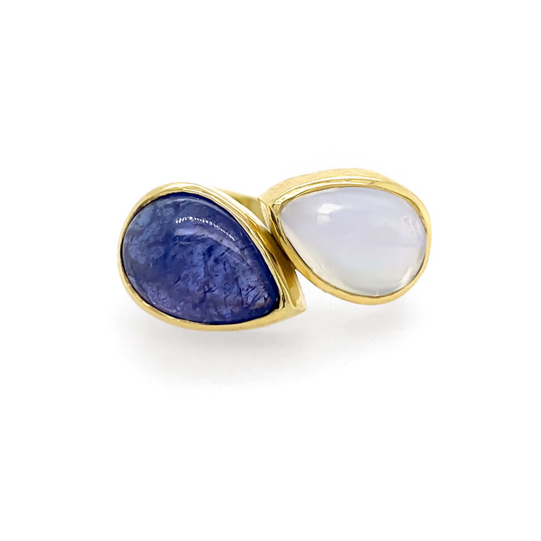 A 14K yellow gold ring with one tanzanite gemstone and one moonstone gemstone.