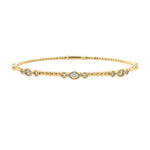 14K Gold bracelet with trio diamond stations on a white background