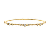 14K Gold bracelet with trio diamond stations on a white background