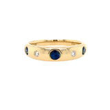 14K Gold ring with sapphire gemstones and diamonds on a white background