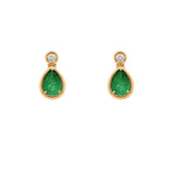 Pair of 14K yellow gold earrings with emerald green gemstones and diamonds on a white background