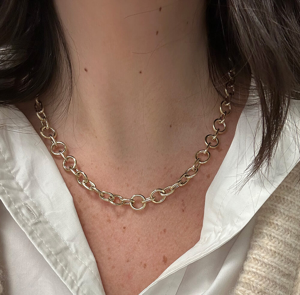 14K Gold Circle Link chain necklace worn by a woman with a white shirt and brown hair.