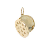 A 14K gold locket pendant with a hinged lid, featuring small star-shaped engravings and clear diamonds on the front, shown open against a plain white background.