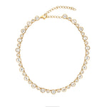 14K Gold necklace with white topaz stones on a white background