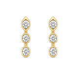 A pair of 14K gold drop earrings featuring three round-cut clear diamonds in each earring, set against a plain white background.