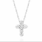 A white gold cross pendant necklace adorned with clear round-cut diamonds, suspended from a delicate white gold chain against a plain white background.
