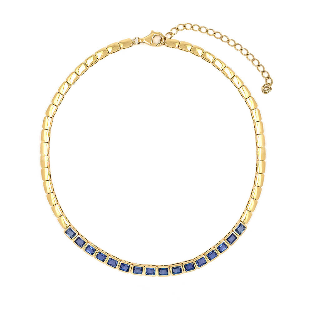 A 14K yellow gold chain necklace with a row of square-cut blue sapphires along the front, displayed on a clean white background.