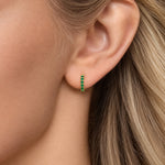 14K yellow gold emerald huggie earrings