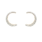 Pair of 14K gold C-shaped earrings with diamonds on a white background