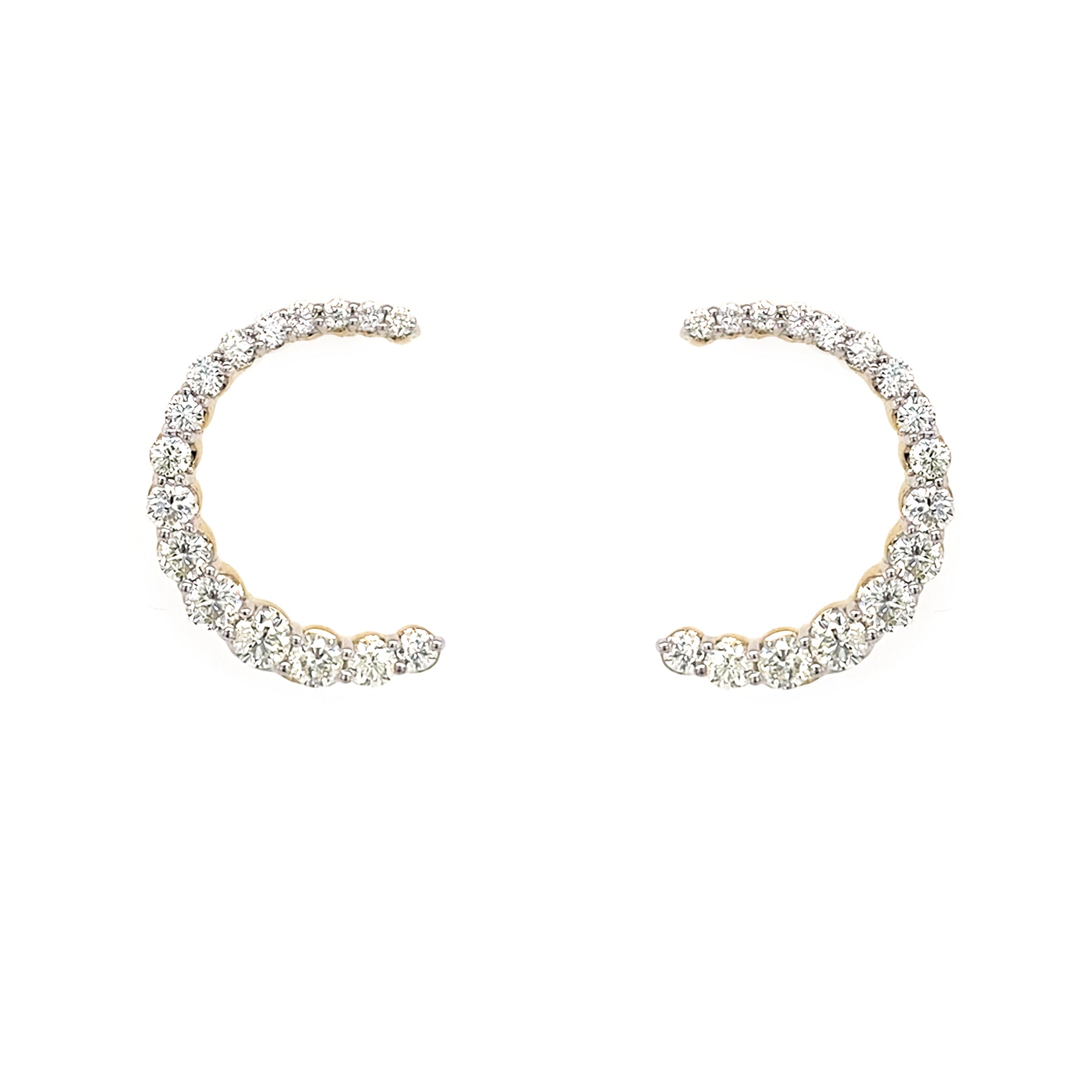 Pair of 14K gold C-shaped earrings with diamonds on a white background