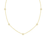 A 18K yellow gold necklace with a series of twist bezel set diamonds by the yard.