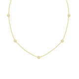 A 18K yellow gold necklace with a series of twist bezel set diamonds by the yard.