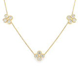 An 18K yellow gold necklace featuring 3 diamond encrusted clover stations.
