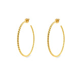 A pair of 18K yellow gold twist hoop earrings on a white background.