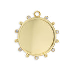 An 18K gold beaded disc-shaped pendant adorned with diamonds around the edge.