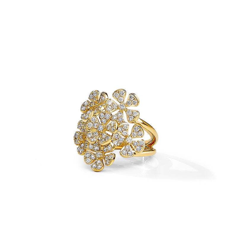 An 18K yellow gold diamond flower ring with multiple diamond petals surrounding a central point.