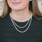 model wearing 18K gold diamond tennis necklaces