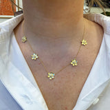 18K gold pave diamond 5 station flower necklace on model