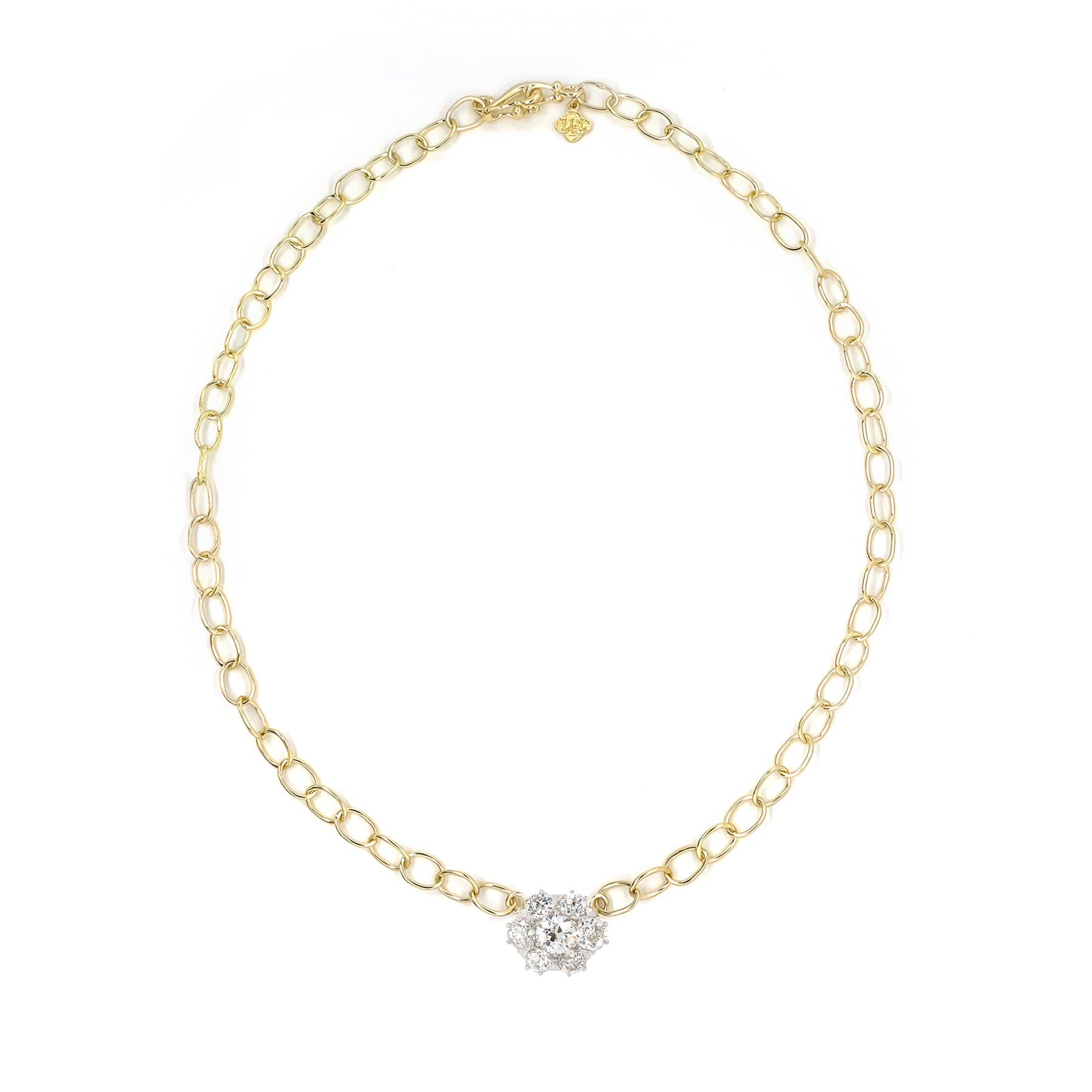 An 18kt yellow gold chain necklace with a solitaire diamond pin attached to the end.