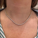 18K Yellow Gold Diamond Tennis Necklace worn by a woman with a striped garment
