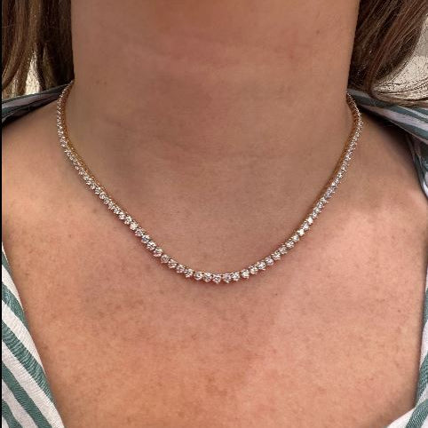 18K Yellow Gold Diamond Tennis Necklace worn by a woman with a striped garment